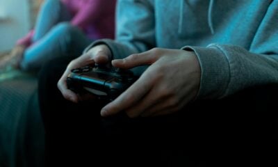 Person holding game controller