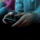 Person holding game controller