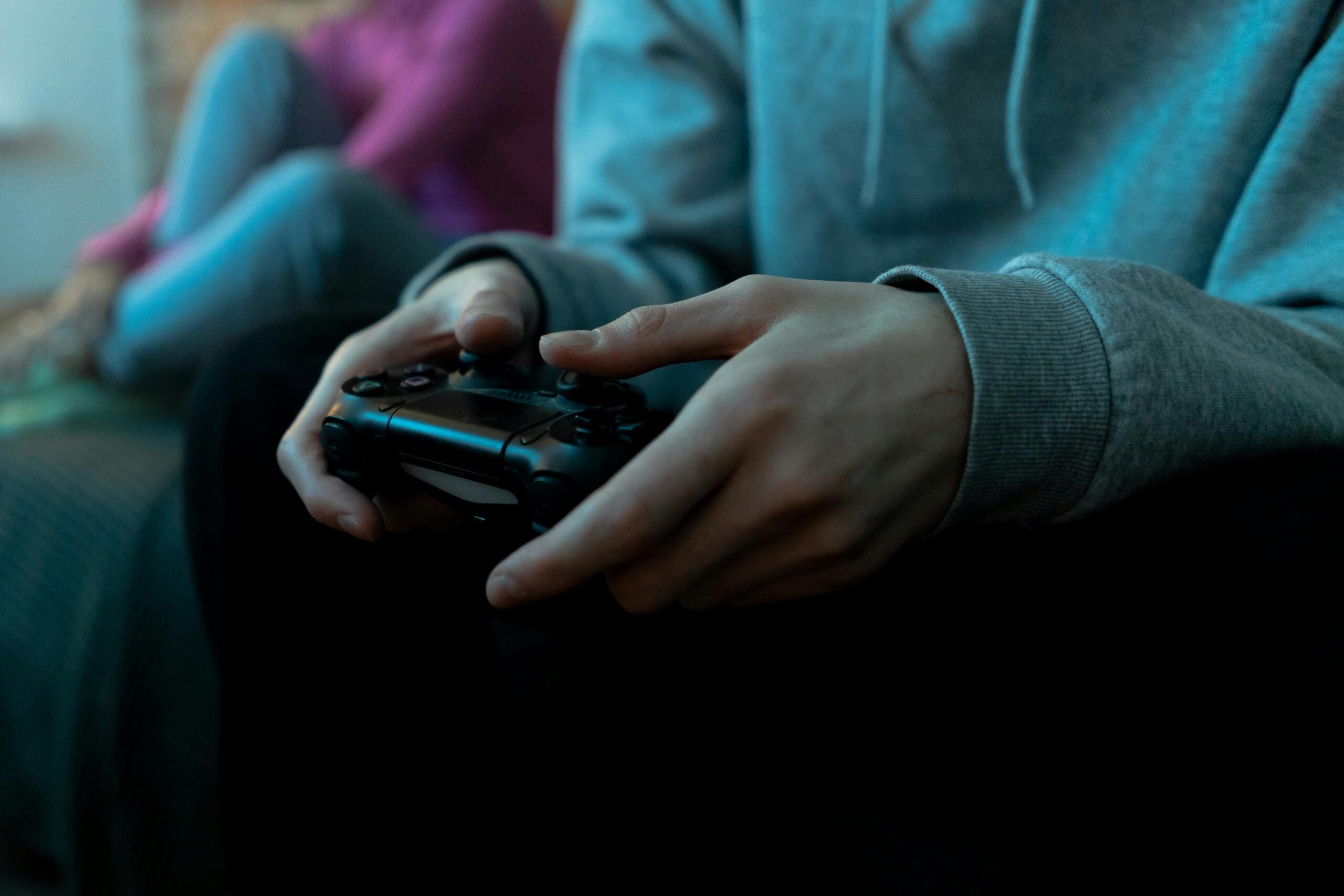 Person holding game controller
