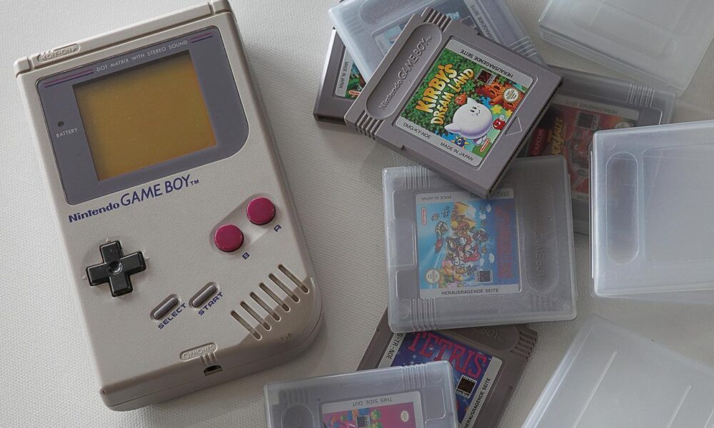 Game Boy and Games for Game Boy on table