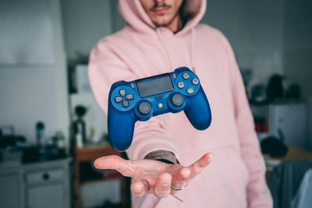 Guy Holding Gaming Controller