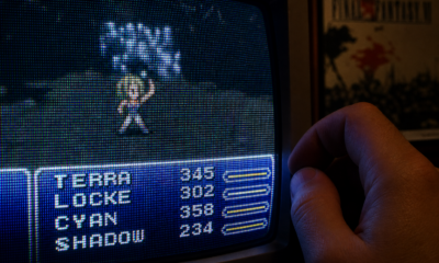 Person plays retro game on CRT monitor, adjusting settings