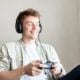 Man playing video game and listening to Music