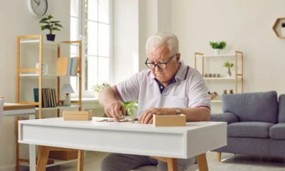 Elderly man playing game